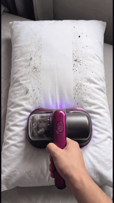 Aspiradora en uso sobre una almohada